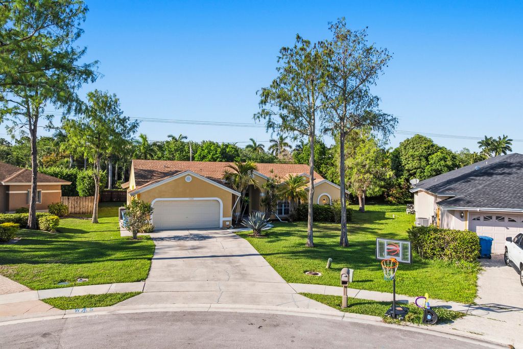 Photo of 104 Oxford Court, Royal Palm Beach, FL 33411 (MLS # B26023561)