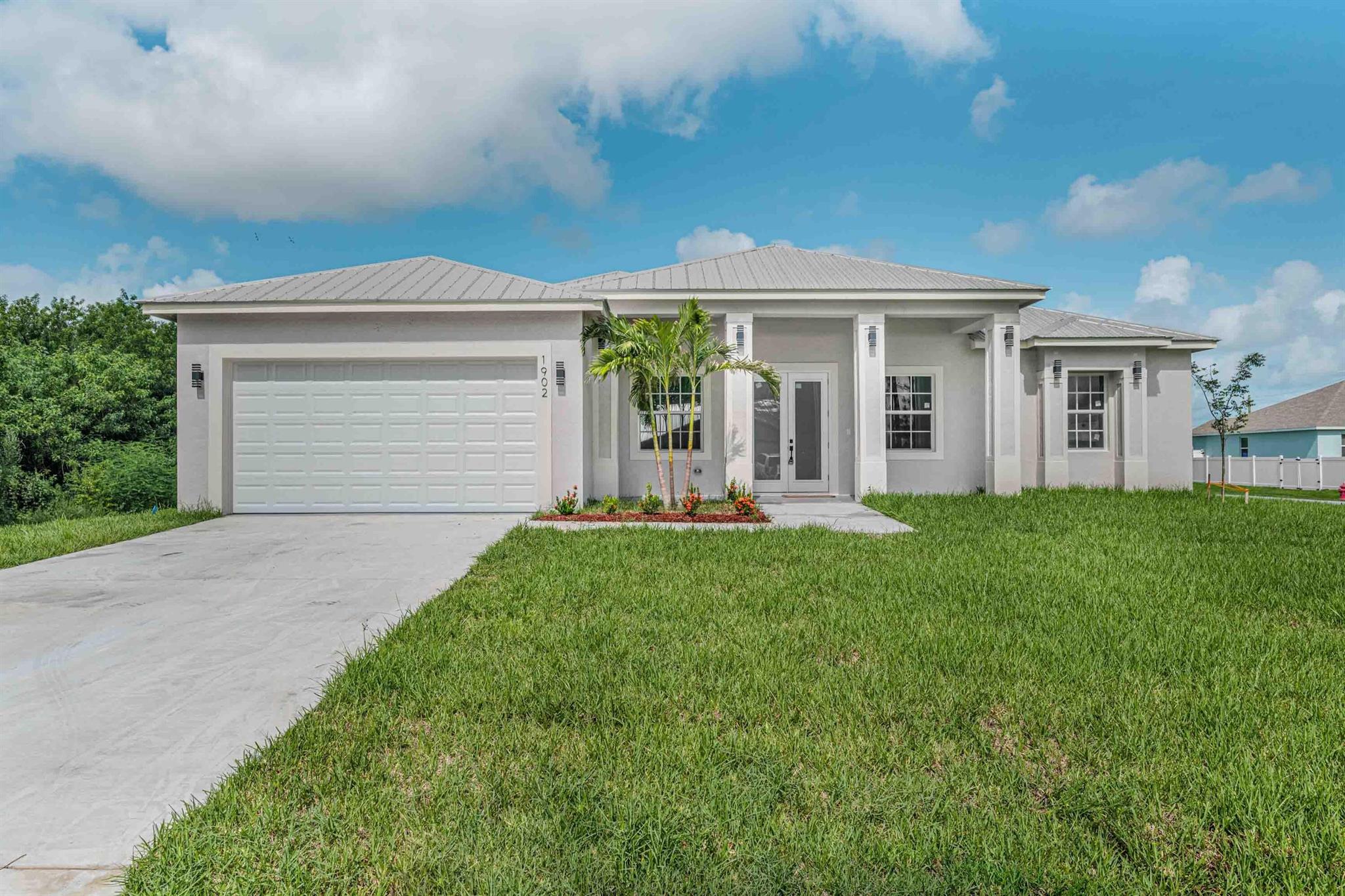 STUNNING MOVE IN READY NEW CONSTRUCTION ON INCREDIBLE LOT! 4 BEDROOM, 3 BATH PLUS DEN AND COVERED LANAI. EXCELLENT UPGRADES INCLUDE A METAL ROOF, COMPLETE IMPACT GLASS, QUARTZ COUNTERTOPS, TILE BACKSPLASH, DOUBLE DOOR ENTRY, STAINLESS STEEL APPLIANCES INCLUDING WINE COOLER, 8FT HEIGHT DOORS, FREESTANDING TUB, FRAMELESS GLASS, SPRINKLER SYSTEM, UPGRADED GRASS, GUTTERS, PAVER DRIVEWAY, HUGE BACKYARD WITH SMALL CANAL, EXTENDED BACK PORCH AND MUCH MORE. THE FINAL PRODUCT MAY VARY.