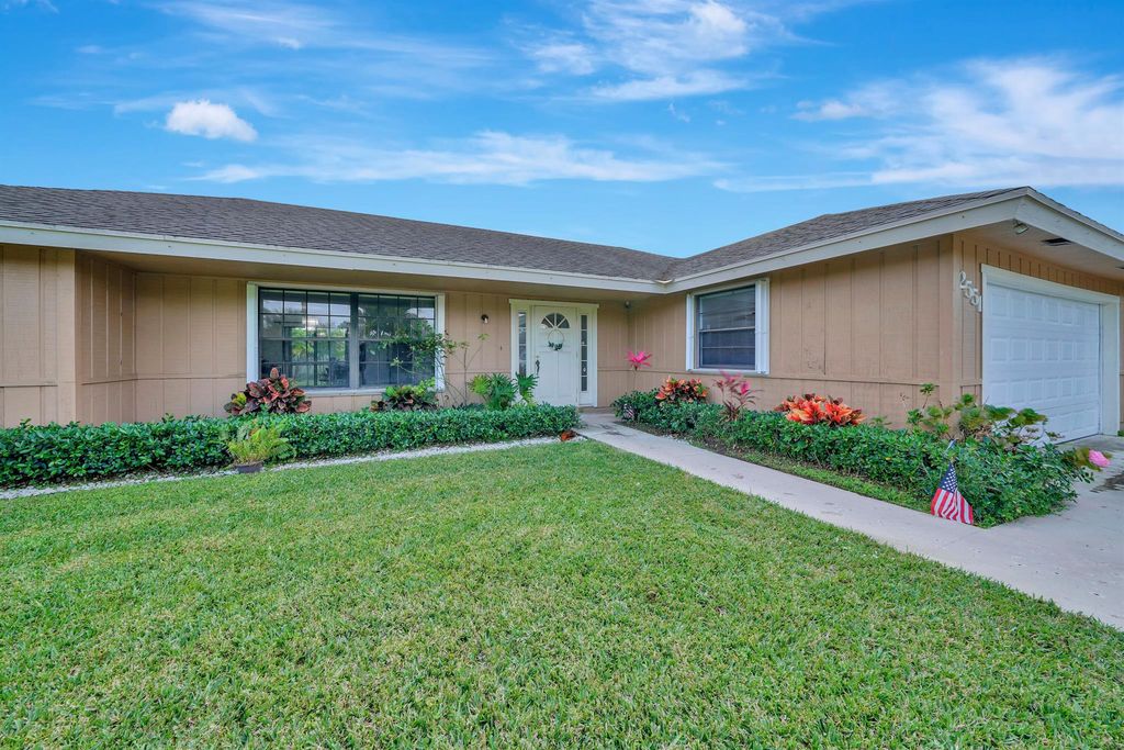 Photo of 2551 Westchester Drive, Riviera Beach, FL 33407 (MLS # R10950408)