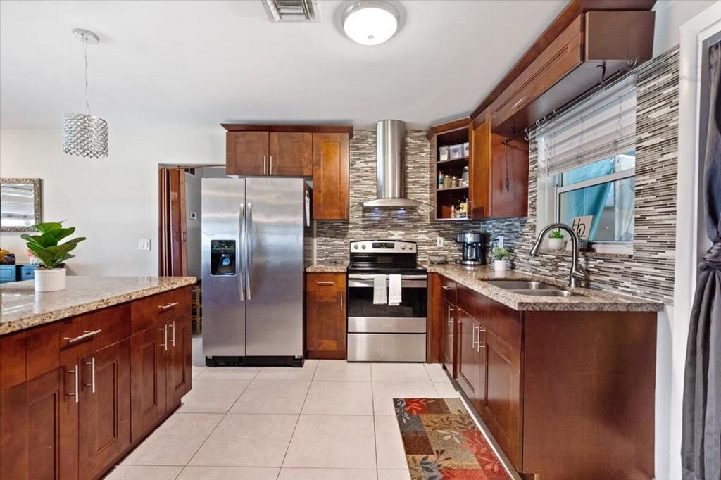 Photo of 548 Cypress Drive, Lake Park, FL 33403 (MLS # R10779503)