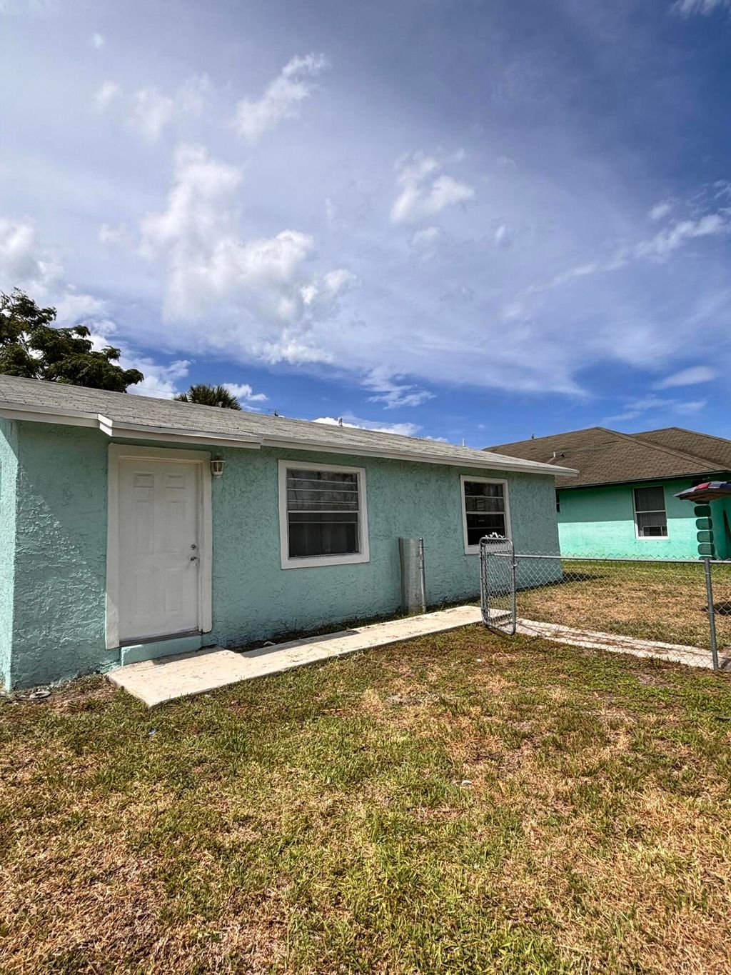 Photo of 1328 W 6th Street, Riviera Beach, FL 33404 (MLS # B26038303)