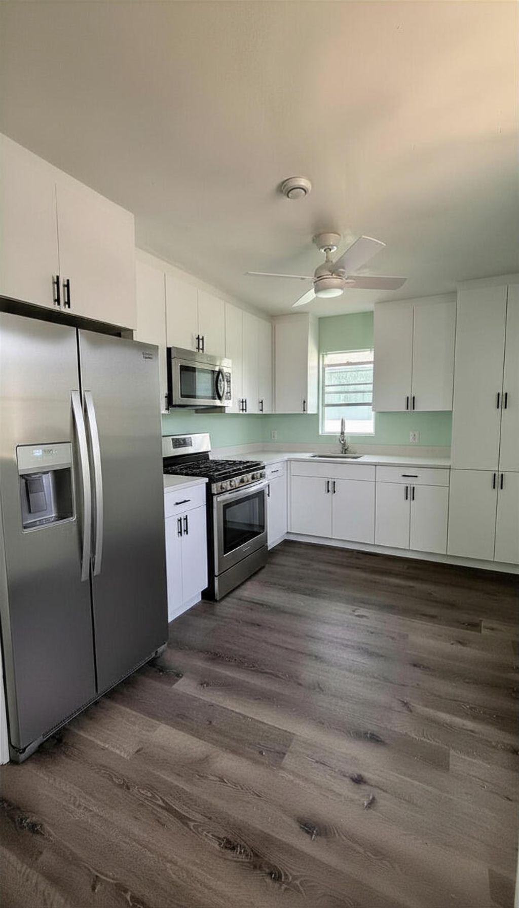 Photo of 1328 W 6th Street, Riviera Beach, FL 33404 (MLS # B26038303)