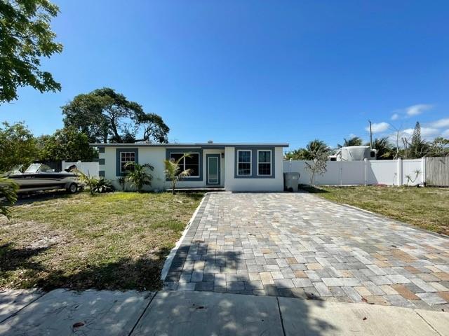Welcome to this charming 2-bedroom, 1-bathroom home with a spacious den currently used as a 3rd bedroom, located in the highly desirable East Pompano area. With no HOA and just minutes from everything Pompano Beach has to offer—shopping, dining, parks, and the beach—this home combines comfort with convenience. Situated on a nearly 10,000 sq. ft. lot, the property offers endless possibilities: create your dream backyard oasis, add a pool, or expand the home to suit your needs. Perfect for entertaining, this move-in-ready home is attractively priced and won’t stay on the market for long! Backyard photos are staged to show endless possibilities!