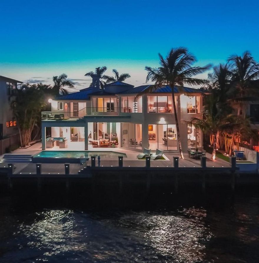 Spectacular new direct Intracoastal estate in exclusive Harbour East enclave.Located on the widest part of the Intracoastal in Boca Raton with breathtaking water views of lake Wayman from all major living areas. This perfect floor plan features 6 bedroom & 6.5 bath, all en-suites, grand entry 26ft ceiling great room with a custom 11ft wine display & a quartz fireplace, European chef kitchen with state of art Italian countertops & waterfall island, Sub Zero & Wolf appliances,custom curbed glass railings & dazzling light fixtures. 11FT sliding impact glass doors open to a extensive 2,250 SqFt outdoor living area with wide open views overlooking the water, including a infinity edge pool, heated spa, summer kitchen & a oversized dock,creating the ultimate outdoor entertainment environment.