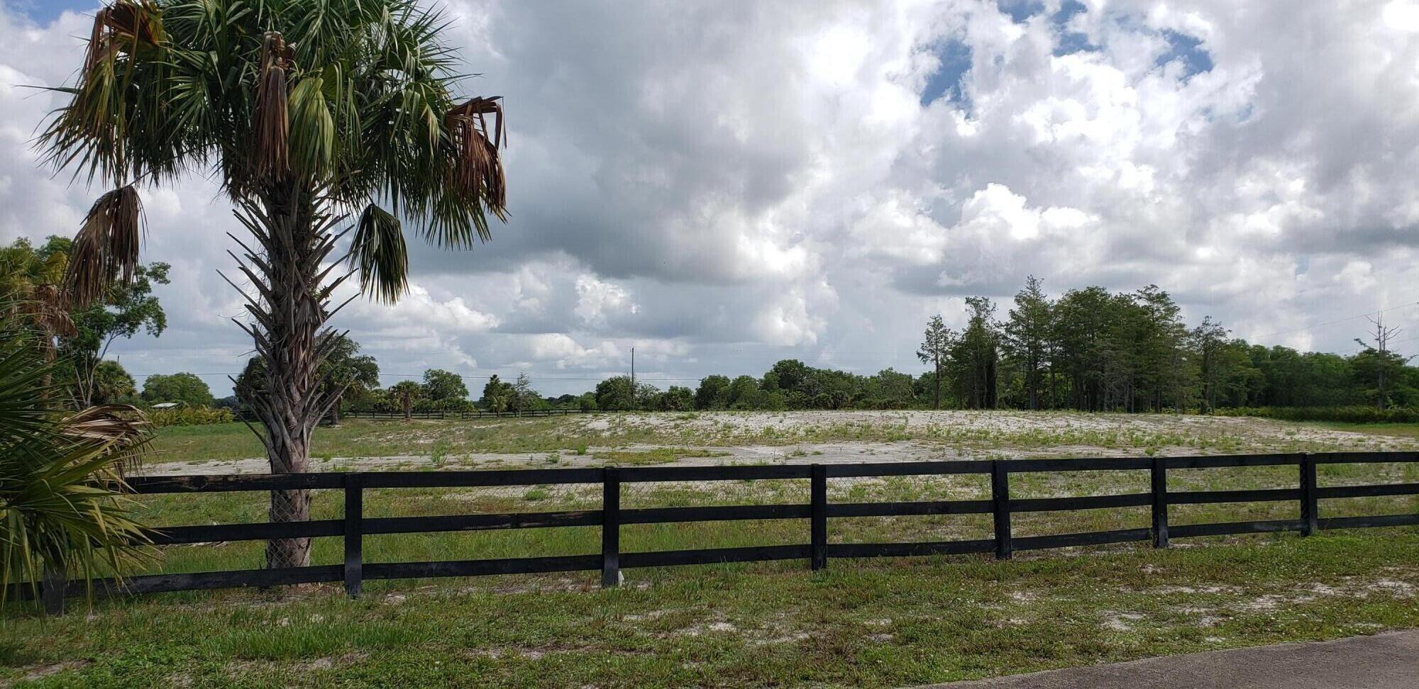 PRICE REDUCTION on this beautiful cleared 5-acre property. Street is quiet and private. high and dry. Deer Run is a residential/equestrian gated community located in Loxahatchee. House pad overlooks large pond, for those awesome views while sitting on your porch. You can also get a pond company to reshape pond and add aerators, lights and fish if you desire. There is also a small pond which you can fill in when you build your beautiful home if you don't want it. Don't miss this awesome opportunity to own 5 acres in Deer Run at a JUST REDUCED PRICE!