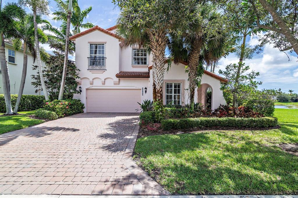 Immaculate pool home located on a lakefront, over sized corner lot! Stunning views from the front and back of the home. Stunning upgrade with hardwood floors throughout upper floors and stairs. Spacious 4 bedroom, 3.5 bath plus loft. Note-one bedroom/bath has a separate entrance-perfect for an office or Nanny. 25 foot ceilings, crown molding, 18'' tile, plantation shutters! The updated kitchen features granite counters, white 42'' cabinets and stainless steel appliances. Light and bright with huge windows. The master suite has a balcony over looking the pool and lake. Pool is in a screened enclosure with a large patio and large summer kitchen. Evergrene is a gated community with a club house that offers resort style amenities. Close to schools, highways, beaches, shopping restaurants.