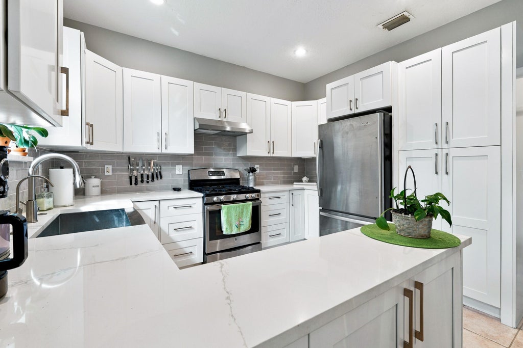 Photo of 1034 Cape Cod Terrace, Greenacres, FL 33413 (MLS # B26090310)