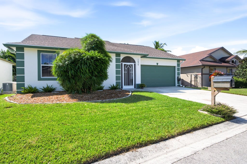 Photo of 1034 Cape Cod Terrace, Greenacres, FL 33413 (MLS # B26090310)