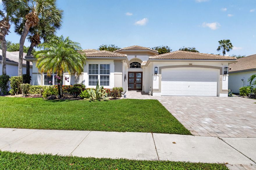 Welcome to this beautiful 4 bedroom 2.5 bath home, designed for both comfort and style. From the moment you arrive you'll notice the exceptional curb appeal, featuring new pavers, impact windows and doors and a newer roof. Step inside and be greeted by a thoughtfully designed floorplan that feels both inviting and spacious. The updated kitchen features cream colored cabinetry, granite countertops and ample space for cooking and entertaining. All bathrooms have been updated. Enjoy a spacious, screened in patio  designed for indoor-outdoor living, offering plenty of room to relax overlooking serene lush greenery. Located in a vibrant 55+ community, residents enjoy an array of amenities. the renovated clubhouse offers 2 resort style pools, pickleball, tennis, gym, cafe, games & social.