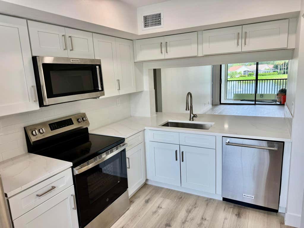 Photo of 6962 Briarlake Circle #203, Palm Beach Gardens, FL 33418 (MLS # B26059674)
