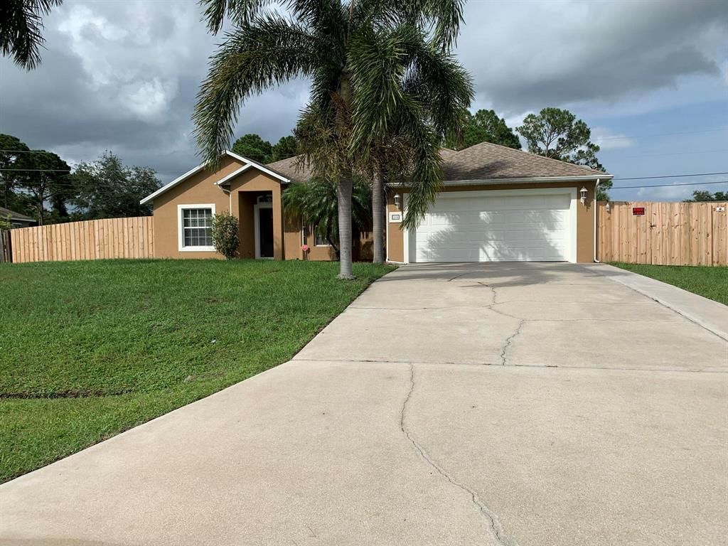 Photo of 214 SW Milburn Circle, Port Saint Lucie, FL 34953 (MLS # R10877355)
