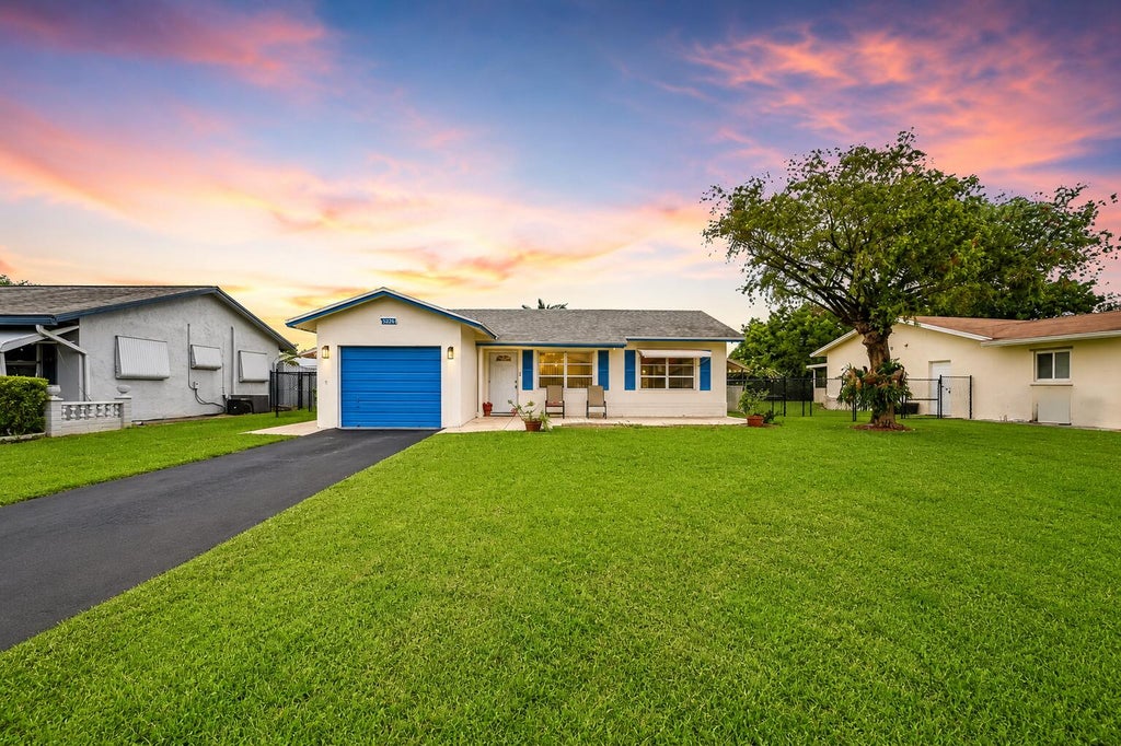 Photo of 9505 NW 73rd Street, Tamarac, FL 33321 (MLS # B26035790)
