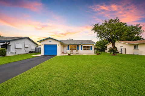 Photo of 9505 NW 73rd Street, Tamarac, FL 33321 (MLS # B26035790)