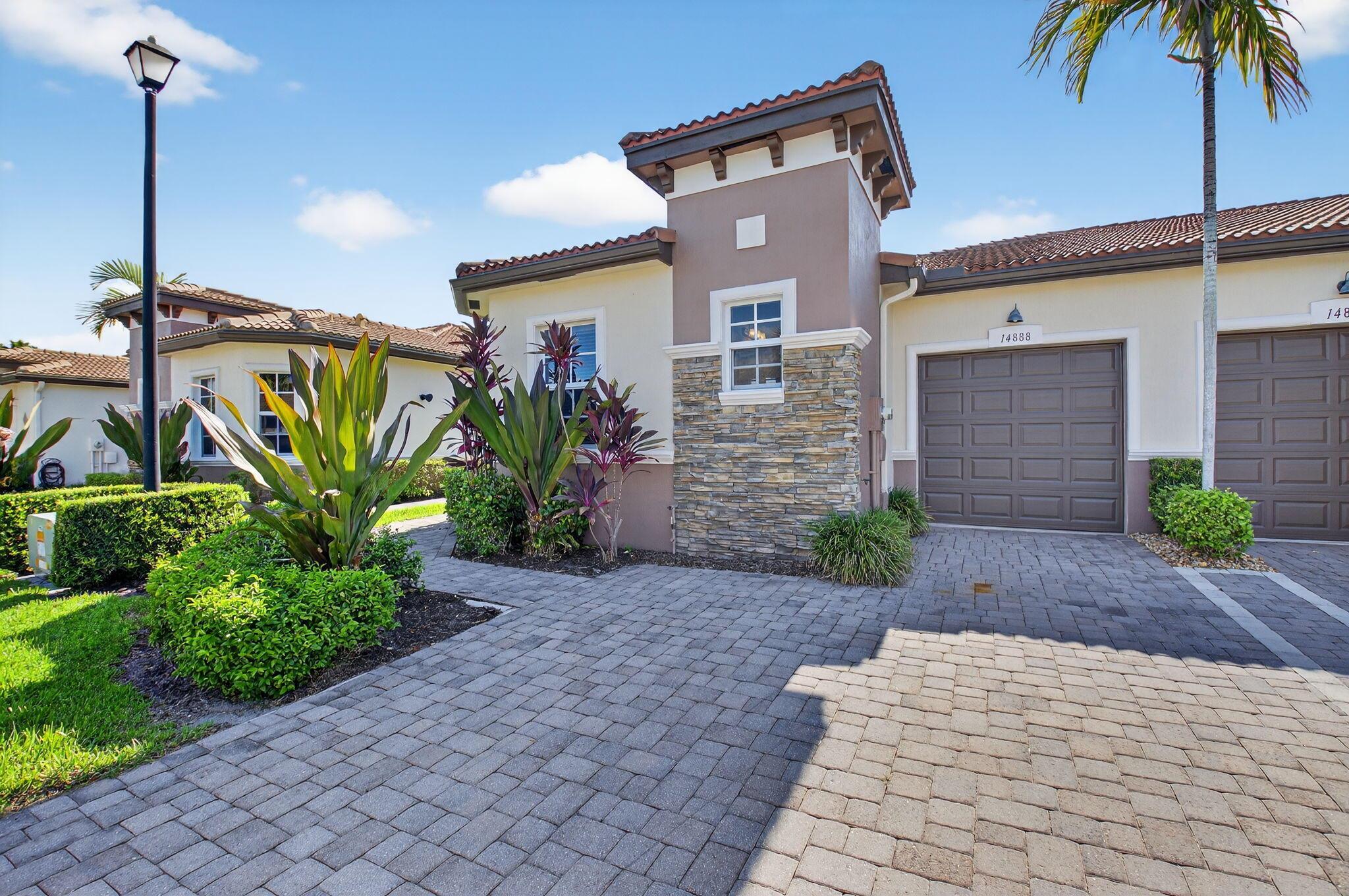 Pristine 2 bedroom, 2 bath and den end unit ''Polina'' 1 car garage villa is close to the clubhouse. Extra windows for more sunlight. Move in ready! Wood kitchen cabinets, granite counter tops, stainless steel appliances, light tile flooring, dual sinks in primary bathroom with free standing shower, walk-in closet, hi-hats, crown molding, built in shelving in den and screened lanai on private garden lot. Villaggio Reserve is an active 55+ community perfectly located minutes from the turnpike and downtown Delray Beach.38,000 sq ft clubhouse with a lap pool, resort style pool, kiddie pool, jacuzzi, cafe, fitness center, 2 bocce ball courts, 5 tennis courts and 6 pickleball courts.Seasonal shows and various clubs to enjoy. Live your best life at Villaggio Reserve!