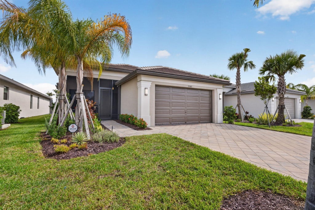 Photo of 12445 SW High Tide Road, Port Saint Lucie, FL 34987 (MLS # B26066880)