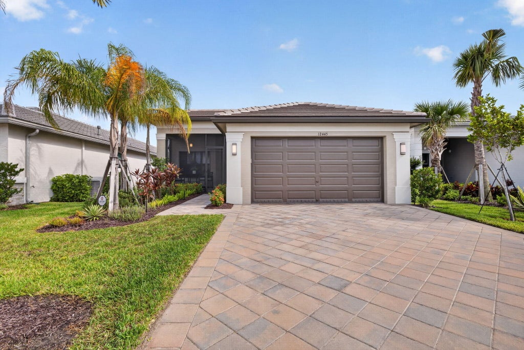 Photo of 12445 SW High Tide Road, Port Saint Lucie, FL 34987 (MLS # B26066880)