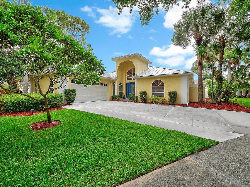 This beautiful home has been remodeled from head to toe. You will love cooking in this chef's appointed kitchen complete with gorgeous wood cabinetry, granite counters, stainless appliances and gas stove. Enjoy basking in the natural sunlight and soft colors in this split floor plan home with an updated master bath, laminate wood flooring, beautiful tile, french doors and a fabulous covered patio for entertaining that overlooks the freshly updated pool with new filter housing, salt water system (2016) and electric & solar heater. The yard is completely fenced and has amazing views of the lake. Bonus room off the back of the master bedroom can be used for a nursery or private study. Metal Roof (2014), New A/C (2017), Water Heater (2009). See additional features in Documents.