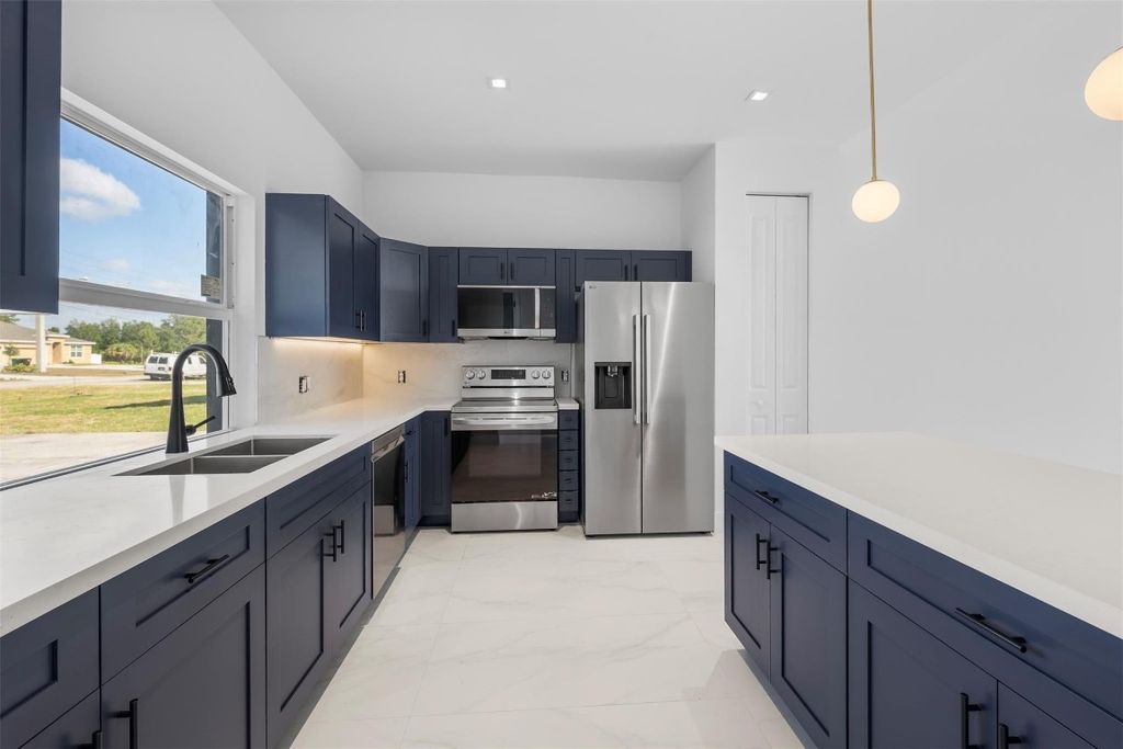 Photo of 4043 SW Port St Lucie Boulevard, Port Saint Lucie, FL 34953 (MLS # F10504226)