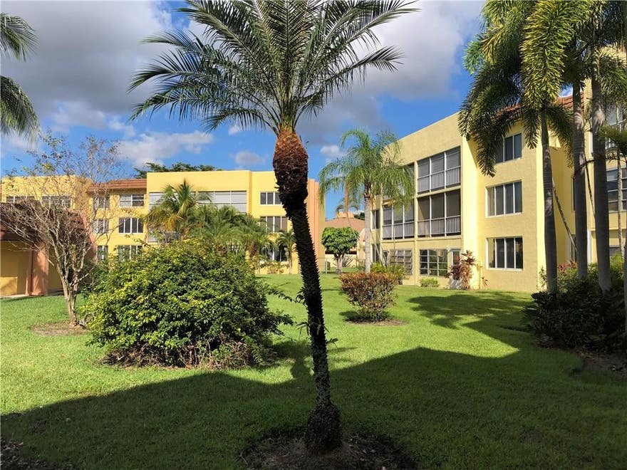 55+ community. Lovely 1/1.5 condo with enclosed balcony overlooking pool and garden. Very bright and airy. Tile floors throughout. Great location. Building has an elevator. Community is well kept and offers many amenities. One assigned parking space. Must wait one year to rent out. Cable service included in condo fees.