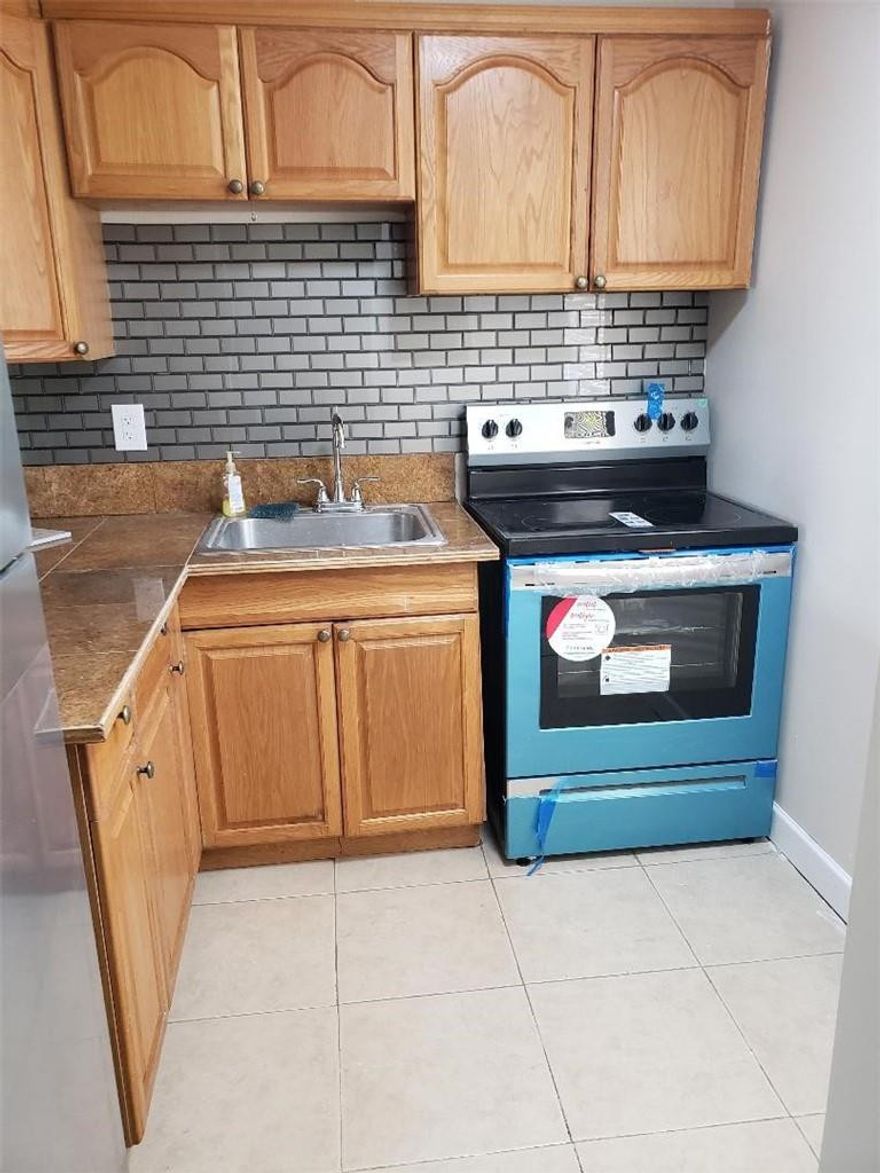 Updated top floor condo with brand new AC, water heater, new fridge, new oven. New Vinyl wood blank just installed thru out living areas and bedroom. Freshly painted walls and new grass turf on patio. Lots of closet space and walkin closet in bedrm. ***Bathtub to be sanded and painted***. Can be purchased and rented right away, 55+ community. 10 minutes to the beach and close to shopping centers.