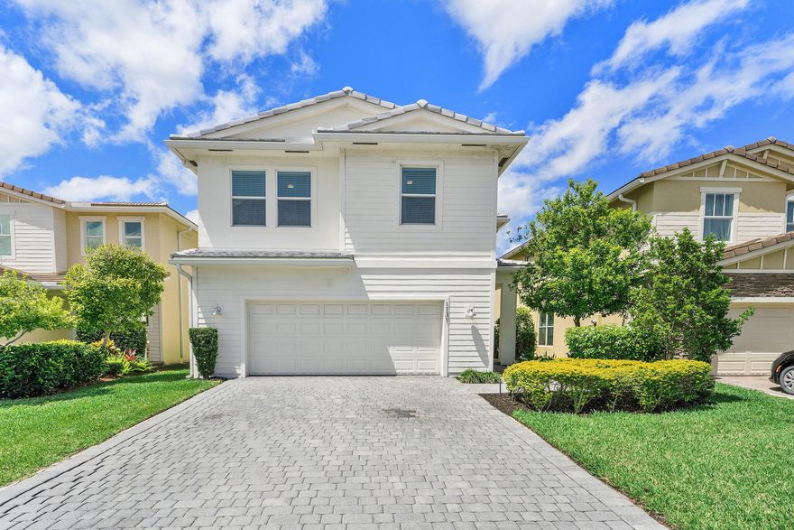 Located in the desirable gated community of Veleiros, this 2020-built home features a bright, open layout filled with natural light. The kitchen offers a large island, quartz countertops, SS appliances, pantry, and wood shaker cabinetry, plus new washer, dryer, and microwave. All bedrooms, loft, and laundry room are conveniently located upstairs. The spacious primary suite includes an oversized walk-in closet and en-suite bath with dual vanities. Enjoy tranquil waterfront views from the fully fenced yard with an extended porcelain paver patio. Hurricane impact protection. Garage storage. HOA includes landscaping. Resort-style amenities include a pool, fitness center, clubhouse, playground, and on-site management. No rental restrictions- excellent opportunity for homeowners or investors.