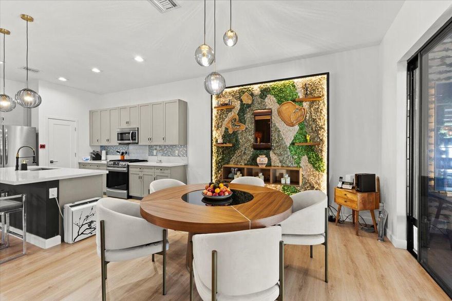 PRIVATE WELLNESS RESIDENCE | GATED COMMUNITY | MINUTES TO FLL & DOWNTOWN   Modern gated wellness residence built in 2020 offering nearly 3,000 SF of indoor-outdoor living just minutes from Fort Lauderdale International Airport, The Fort pickleball complex and FLL Downtown.   New to market and already generating strong interest with multiple showings!   This largest home layout features 2,344 SF of interior space plus a 20' x 30' covered screened lanai creating  almost 3000 SF of everyday living space ideal for families and entertaining. Wellness enhancements include an infrared sauna, flexible exercise or play space, living moss wall, outdoor shower, and backyard accommodating future plunge pool or spa installation (concept rendering available).   Owner Relocating Private showings available by appointment or during scheduled open house  Conveniently located near schools, parks, shopping, and multiple houses of worship. This property is located within the gated Whispering Oaks neighborhood known for its quiet residential character and limited through traffic, this newer construction home offers privacy and functional living rarely found due to the significantly expanded covered outdoor living uncommon within the community.  The property also benefits from very low monthly HOA ($220pm).  The open-concept layout features 12-foot ceilings on both floors, chef's kitchen with oversized island and walk-in pantry, spacious primary suite with soaking tub and dual vanities, and flexible living areas suited for family life, guests, or work-from-home needs.  Impact windows and doors, gas range, tankless water heater, EV charger, and energy-efficient construction throughout.   Owner can convert Sauna room back into a Master Bedroom if required.  The fully turfed backyard provides low-maintenance outdoor enjoyment while allowing future customization. See concept rendering of spa pool.  Community features include gated entry and neighborhood dog park supporting a calm residential environment.  3 light fittings will be replaced with similar