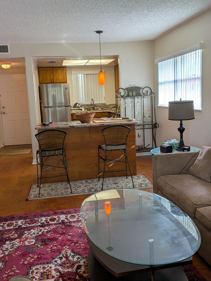 Prime Vero Beach location just minutes from shopping, dining, and only an 11-minute drive to the beach. This spacious corner-unit condo offers 1 bedroom and 1.5 bathrooms and is being sold fully furnished for immediate enjoyment. Ideal as a primary residence, seasonal retreat, or investment opportunity. The unit features a generously sized living room, dedicated dining area, and a modern kitchen with a convenient pass-through to the dining space—perfect for easy entertaining. Residents enjoy a range of community amenities, including a pool, clubhouse, fitness center, and playground. Comfortable, low-maintenance Florida living at its best.