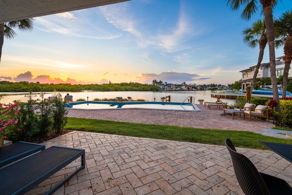 Photo of 1005 Bel Air Dr, Highland Beach, FL 33487 (MLS # R11145514)