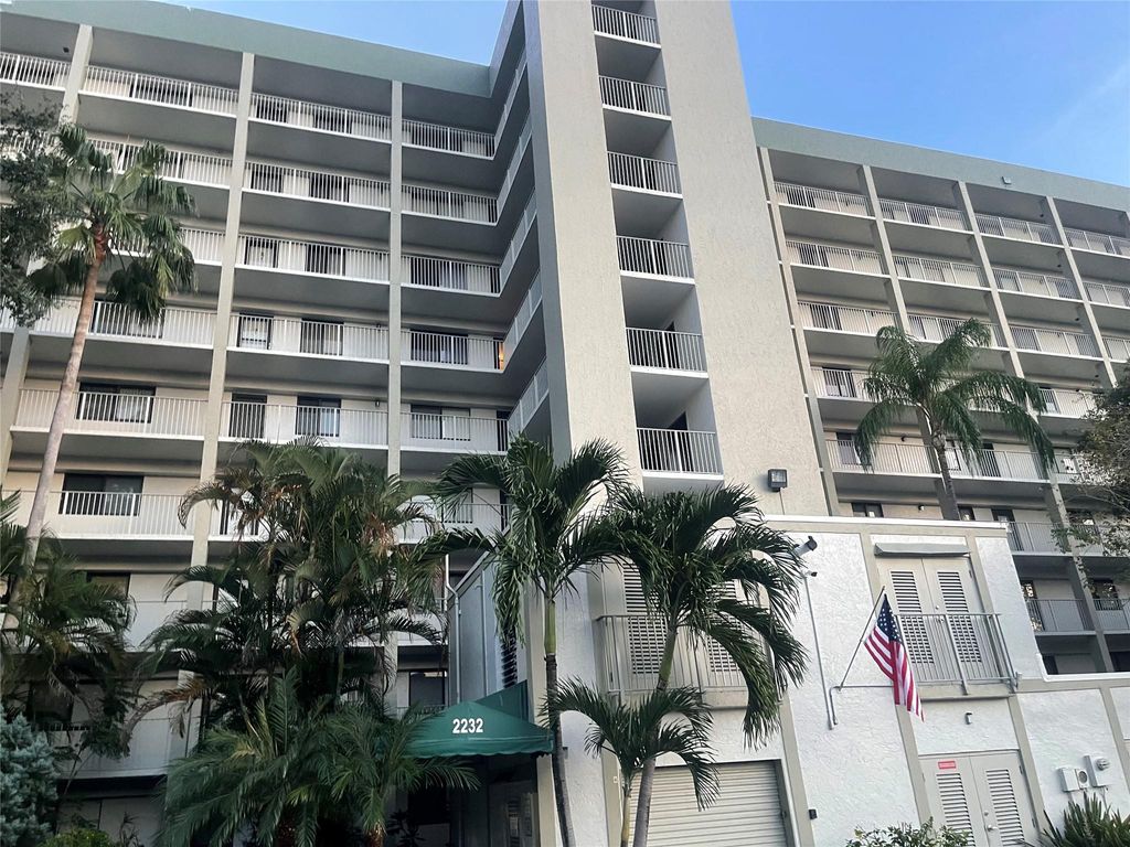 Photo of 2232 N Cypress Bend Dr #104, Pompano Beach, FL 33069 (MLS # F10404835)
