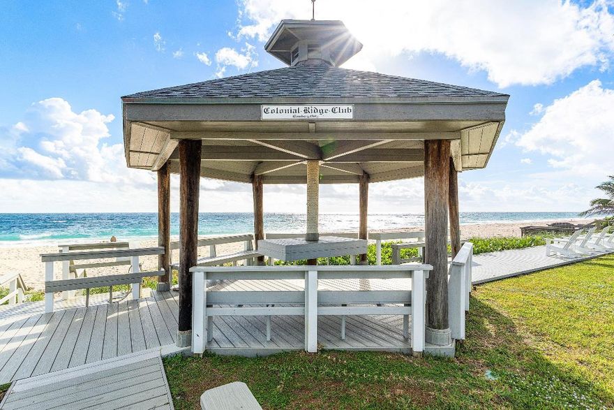 Welcome to one of Ocean Ridge's best-kept secrets, Colonial Ridge on Old Ocean Blvd., in Ocean Ridge, Florida. This beautiful first-floor, 2-bedroom, 1.5-bath unit is move-in ready and designed for relaxed beachside living. Featuring impact windows, a spacious primary suite with a king bed, and a flexible guest room, the home is filled with natural light and comfort. An enclosed porch surrounded by greenery offers the perfect spot to enjoy morning coffee or unwind in the evening. Located in a small gated oceanfront community, residents enjoy 200 feet of private beach access with a gazebo, a heated pool, clubhouse, BBQ area, shuffleboard, and bocce courts. Just steps from the sand and a short walk to restaurants and shops, the location is ideal—nestled between Delray Beach and Boynton Beach, minutes from Atlantic Avenue's dining, shopping, and nightlife.
Wake up to stunning sunrises, stroll along Old Ocean Blvd., or relax by the pool after a day at the beach. Only 20 minutes from PBI Airport, this worry-free coastal retreat is perfect as a full-time residence or seasonal getaway. Don't miss your chance to own a slice of oceanfront paradise.
