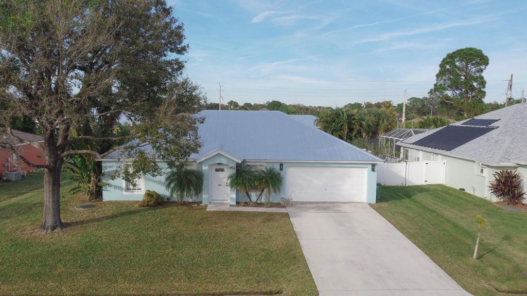 Photo of 1221 SW Crost Avenue, Port Saint Lucie, FL 34953 (MLS # R10950485)