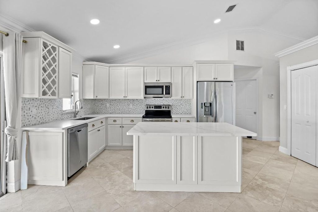 Photo of 1221 SW Crost Avenue, Port Saint Lucie, FL 34953 (MLS # R10950485)