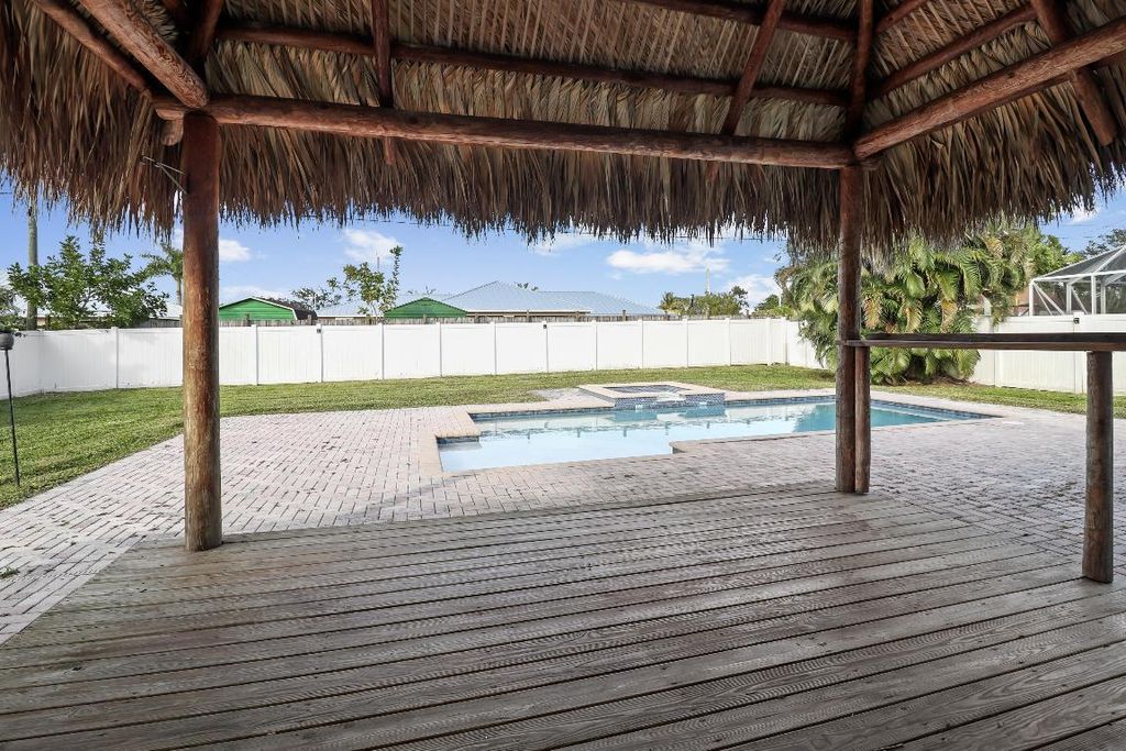 Photo of 1221 SW Crost Avenue, Port Saint Lucie, FL 34953 (MLS # R10950485)