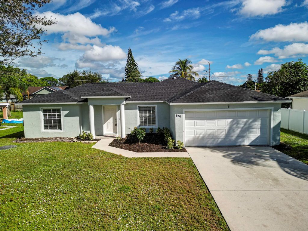 Photo of 881 SW Curry Street, Port St Lucie, FL 34983 (MLS # R10936978)
