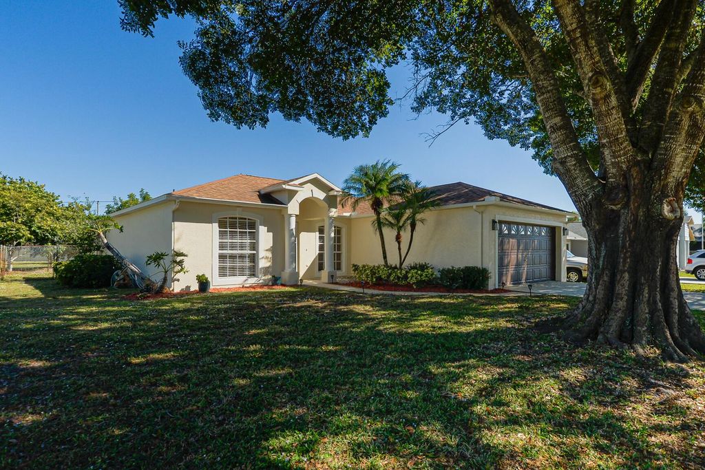 Photo of 2201 SE Carnation Road, Port Saint Lucie, FL 34952 (MLS # R11142701)