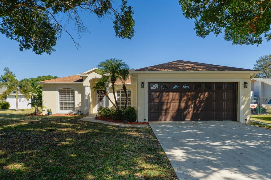 Fabulous oversized lot feature 3 bedroom 2 bath home with 2 Car Garage in the heart of Port St. Lucie! This well-kept property features CBS construction, updated roof in 2018, vaulted ceilings, Flex Room or office, Eat in Kitchen, breakfast bar & spacious family room. Enjoy a bright, well-lit interior with 2 skylights, updated laminate flooring in the bedrooms and tile throughout the main living areas. Bring your toys or room for a pool with fenced backyard is perfect for entertaining, pets, or future outdoor projects. Located in a established neighborhood close to shopping, dining, schools, hospitals, and local beaches--an excellent opportunity on the Treasure Coast! The Treasure Coast has beautiful waterways for fishing, boating & beaches. Only 45 minutes from Palm Beach Airport.