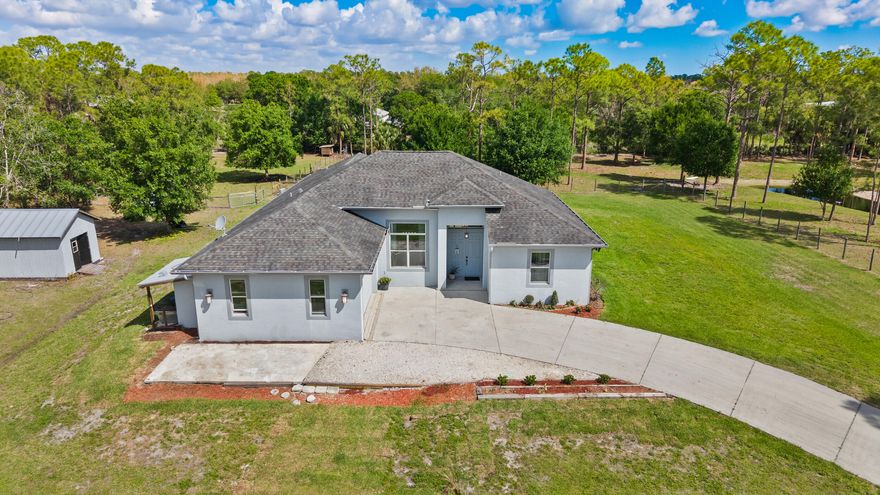 Private Palm City Farms retreat on 5 scenic acres with a natural preserve buffer, offering a rare blend of privacy, usable land, & everyday comfort. This 2016-built home features well-designed living space with an open, functional layout ideal for both relaxing & entertaining. The cleared pasture provides ample room for horses, hobbies, equipment, or future additions, while the preserve area enhances privacy & peaceful views. With no HOA, enjoy the flexibility to create your ideal acreage lifestyle -- add a barn, pool, workshop, or simply enjoy the wide-open space. Conveniently located  with easy access to I-95, the Turnpike, shopping, dining, & top-rated Martin County schools. A unique opportunity to enjoy space, privacy & potential in one of the area's most sought after communities!
