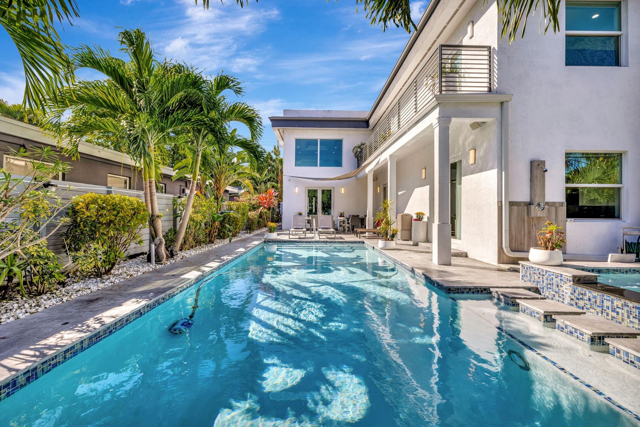 Introducing Casa Hermes—a home so unique it carries its own name. Just steps from Wilton Drive, this 5-bed, 5-bath estate defines modern luxury with soaring 22-foot ceilings, dramatic open spaces, and light-filled interiors that inspire awe. Each bedroom is a sanctuary with en-suite spa baths, while the gourmet kitchen is a stage for both culinary artistry and unforgettable entertaining. Designed for those who value both beauty and function, Casa Hermes is more than a residence—it is an exclusive lifestyle, a statement of prestige, and a rare opportunity to own an iconic address in the heart of Wilton Manors.