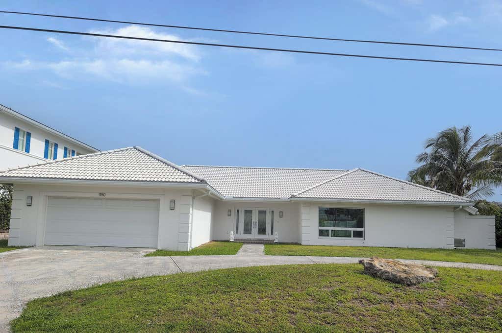 Photo of 1190 Bimini Lane, Riviera Beach, FL 33404 (MLS # B26056387)