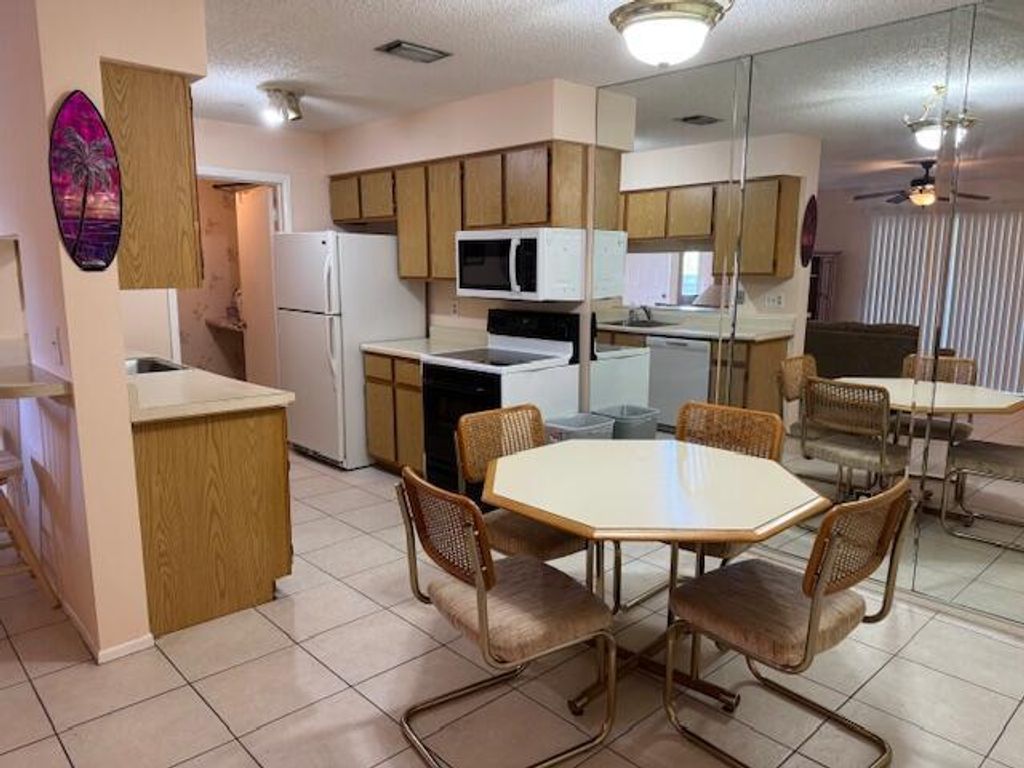 Photo of 4065 NW Cinnamon Tree Circle, Jensen Beach, FL 34957 (MLS # R11090418)