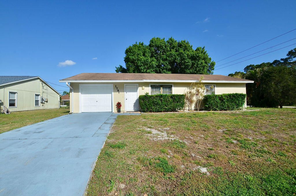 Photo of 1791 SW Glade Street, Port Saint Lucie, FL 34953 (MLS # R10782788)