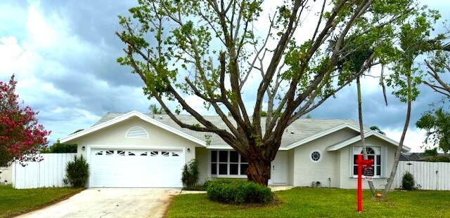 Welcome to your dream home in highly sought after area of Royal Palm Beach! This Beautiful fully renovated 3-bedroom, 2 bathrooms with a family room/den and 2 car garage single family home. This home features a beautiful open floorplan with new tile floors throughout and vaulted ceiling creating a sense of spaciousness and style. The house has renovated bathrooms, new tub, new shower, and new light fixtures. kitchen includes new cabinets, new lighting, new fixtures and new stainless steel appliances featuring sleek quartz countertops with a large Island for extra seating!Entire house has been freshly painted both inside and out. Enjoy the privacy of a fenced-in backyard. Best of all, there's no HOA to worry about! Conveniently minutes away from an array of shopping, the turnpike a