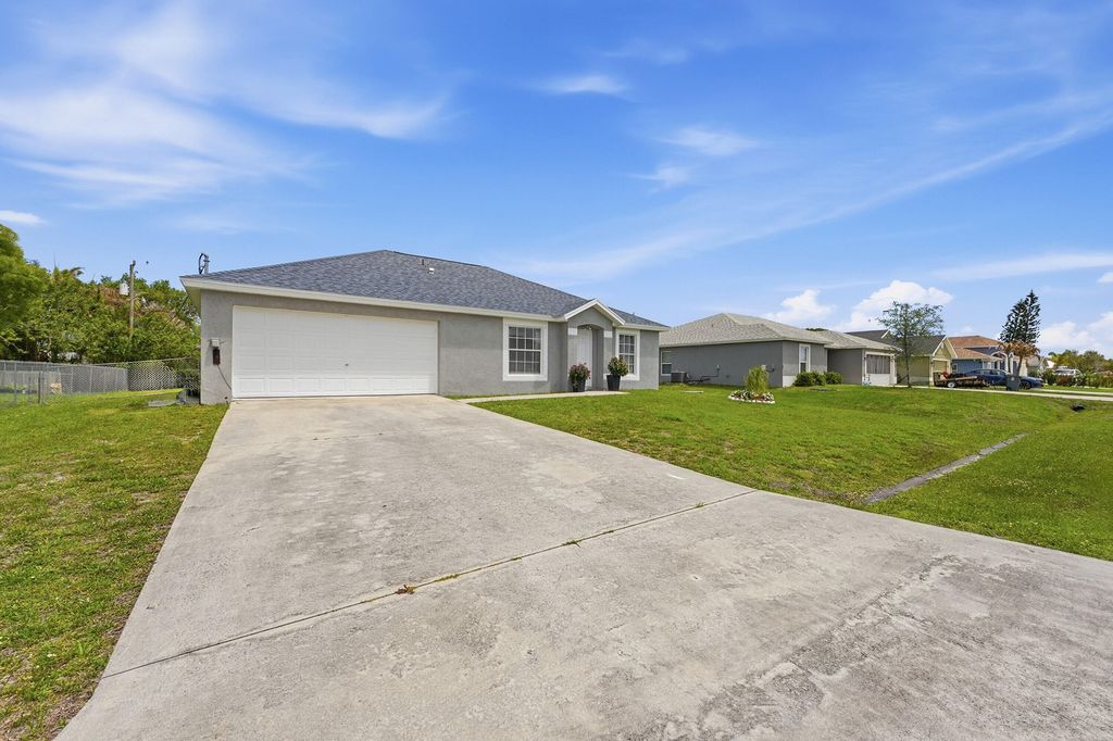 Photo of 461 SW Exmore Avenue, Port Saint Lucie, FL 34983 (MLS # B26014535)