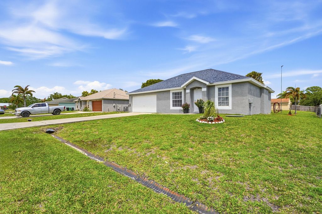 Photo of 461 SW Exmore Avenue, Port Saint Lucie, FL 34983 (MLS # B26014535)