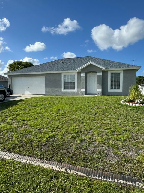 Photo of 461 SW Exmore Avenue, Port Saint Lucie, FL 34983 (MLS # B26014535)