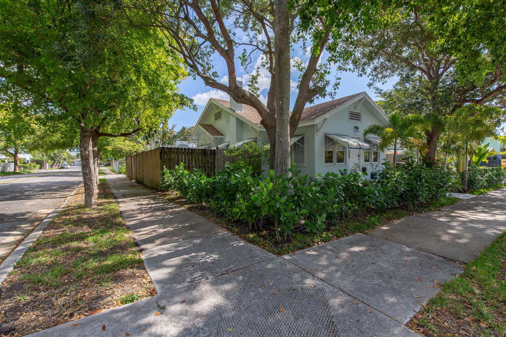 This absolutely charming, totally renovated single family home is ideally situated in North Palm, just walking distance from the water! The chic interior features 2 bedrooms, 1 full and 1 half bathrooms, a Florida room, and a open patio perfect for outdoor dining. This property is offered fully furnished! The home has the beautiful original wood floors throughout the living spaces and gorgeous modern tile in the kitchen and Florida room. The kitchen offers butcher block counters, white shaker cabinets with a stunning blue tile backsplash, and updated stainless appliances with a gas range. The outdoor patio features designer oversized grass inlaid pavers and beautiful tropical landscaping. Utilities are included up to $350/month, no pets allowed.