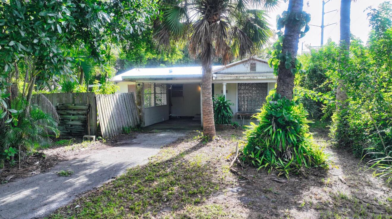 Handyman Special! This 2-bedroom, 2-bath home sits on a half-acre corner lot with a newer metal roof and small pool. Inside, there's plenty of potential to create a third bedroom, making it an even better value for investors or DIY buyers. With room to update and customize, this property is a great opportunity to build equity and transform it into a true gem. Don't miss out on this chance to make it your own!