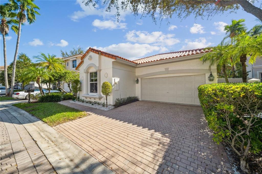 Rarely available Seaside model in Edgewater at Harbor Islands, an exclusive, private-gated Intracoastal community with resort-style amenities & marina. Upgraded home offers PGT hurricane-impact windows & doors, elegantly remodeled kitchen with ceiling-height cabinets, Curava countertops, wall oven, counter depth refrigerator, cooktop, true exhaust...travertine & tile floors, volume ceilings, split bedroom plan...and much more. Homesite features extra space in back. Situated in a suburban setting with urban sized amenities, you are minutes from the best that South Florida has to offer in waterways, beaches, downtowns, Miami and Fort Lauderdale, 2 international airports, shopping, Aventura Mall, Houses of Worship, parks, golf courses, restaurants, entertainment, Gulfstream, and much more.