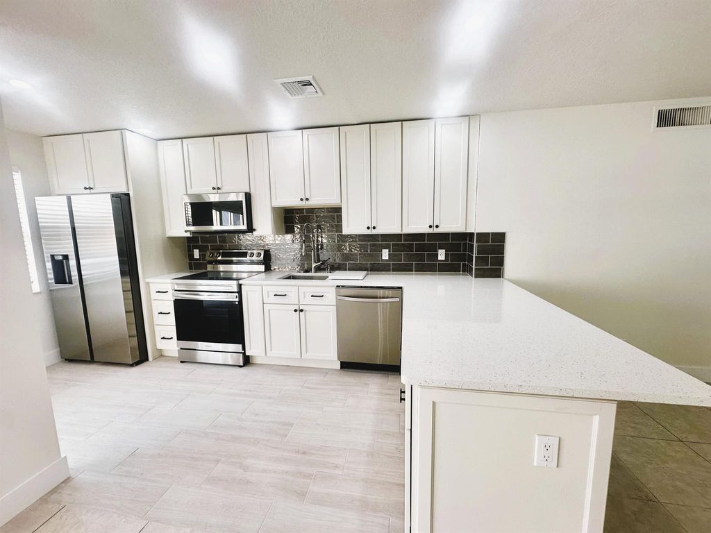 Photo of 19 Colonial Club Drive #203, Boynton Beach, FL 33435 (MLS # R11123217)