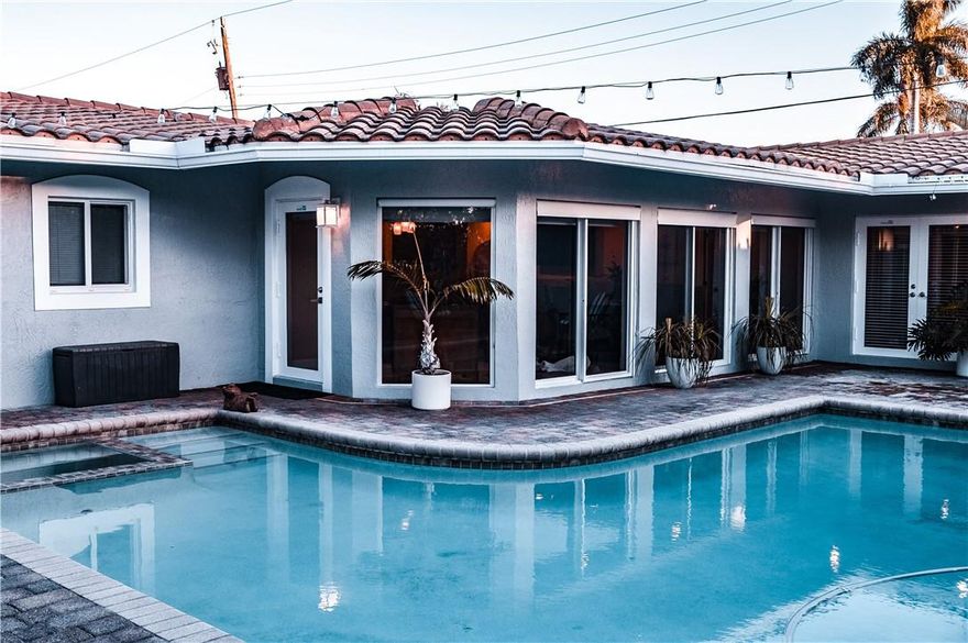 BEAUTFIFUL 3 BEDROOM 4 FULL BATHROOM HOME IN WONDERFUL LIGHTHOUSE POINT, PVC PIPES THROUGHOUT HOME (2021), NEW AC UNIT (2021/SPLIT AC (2021), NEW KITCHEN APPLIANCES (2021), GRANITE KITCHEN COUNTERTOPS, ROOF RESTORED (2021), SALT WATER POOL AND SPA WITH AQUA LINK I LINK CONTROLS, THEATER ROOM WITH 130 INCH PROJECTION SCREEN AND NEW AMPLIFIER (2021), MASTER BATH FULLY UPGRADED, PGT HURRICANE IMPACT WINDOWS THROUGHOUT HOME, FULL CABANA BATHROOM, AND LAUNDRY ROOM.